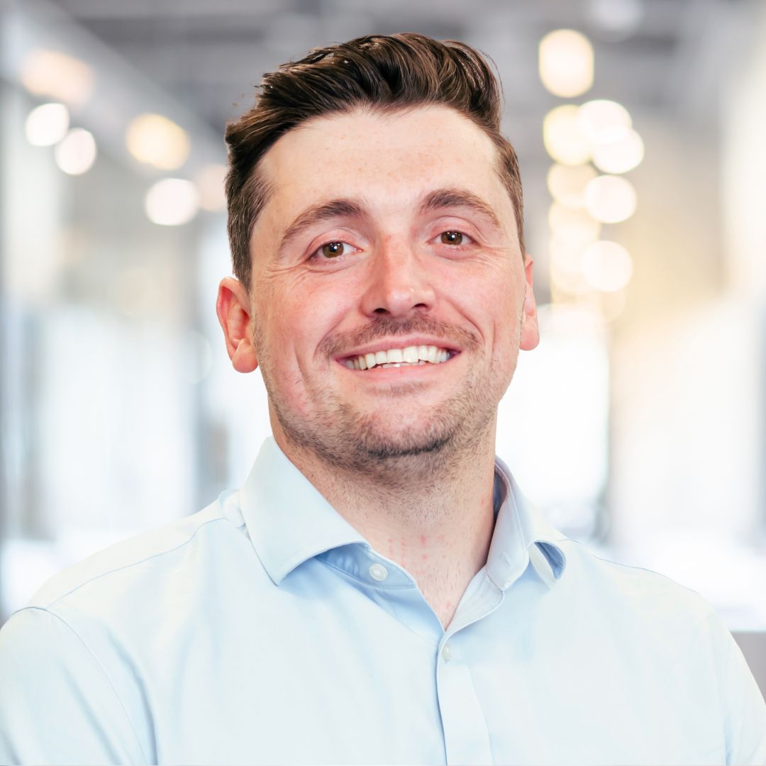 A professional headshot of a person