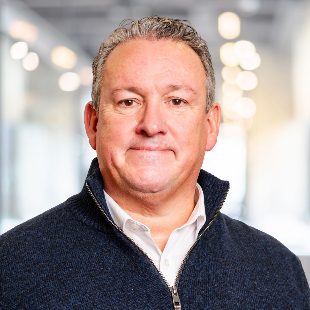 A professional headshot of a person