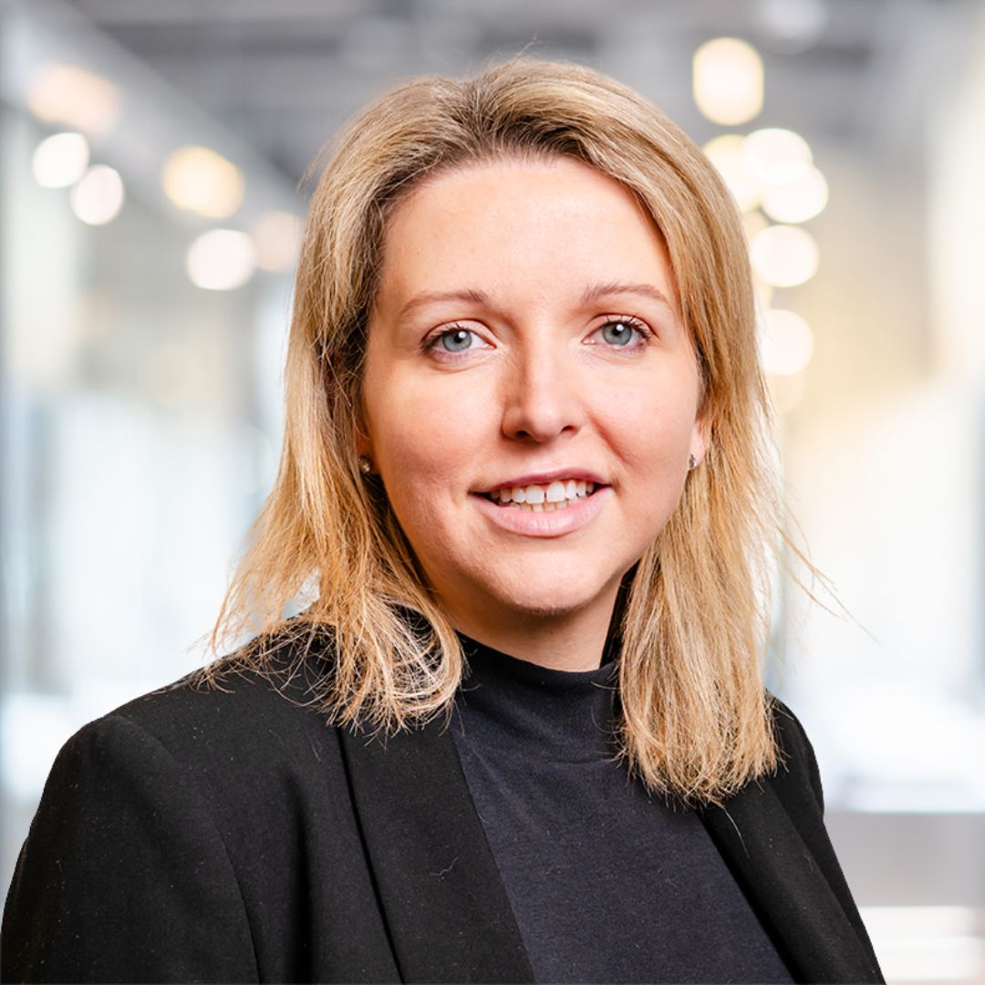 A professional headshot of a person